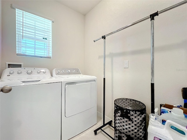 laundry area with washing machine and clothes dryer