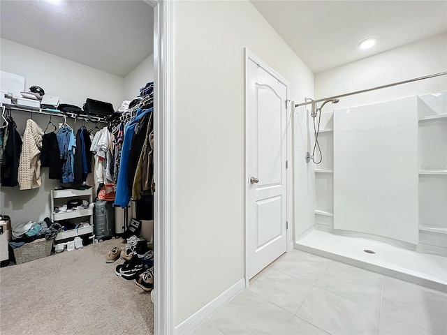 spacious closet featuring light tile patterned floors