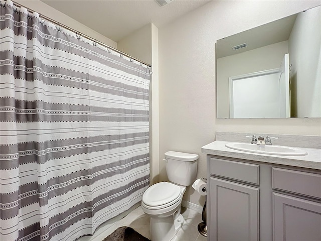 bathroom with toilet, a shower with curtain, vanity, and tile patterned floors