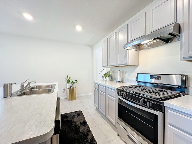 kitchen featuring sink, light tile patterned floors, exhaust hood, and stainless steel gas range