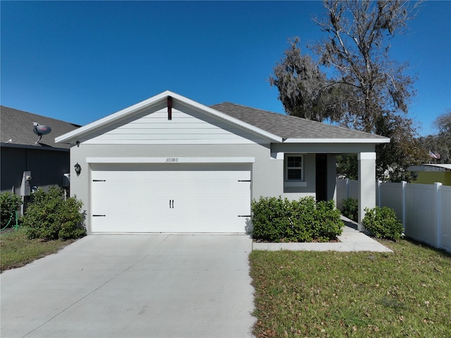 ranch-style home featuring a front yard and a garage