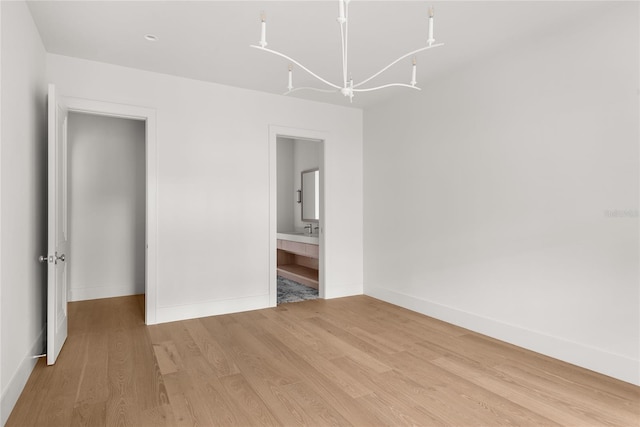 unfurnished bedroom with light wood-type flooring