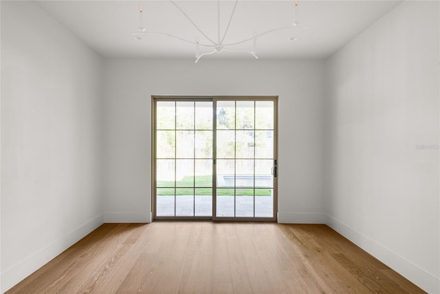 empty room with light hardwood / wood-style flooring