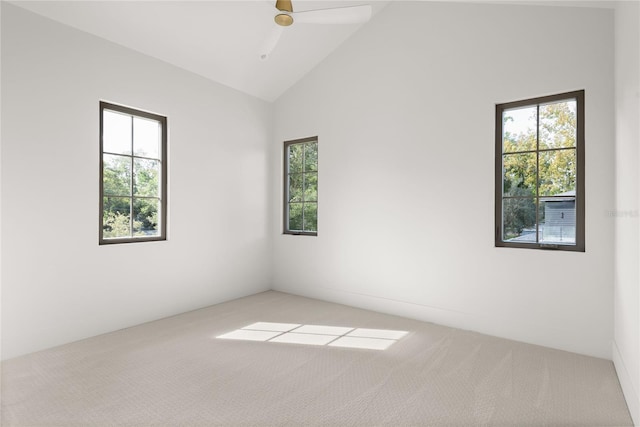 unfurnished room featuring ceiling fan, light carpet, and high vaulted ceiling