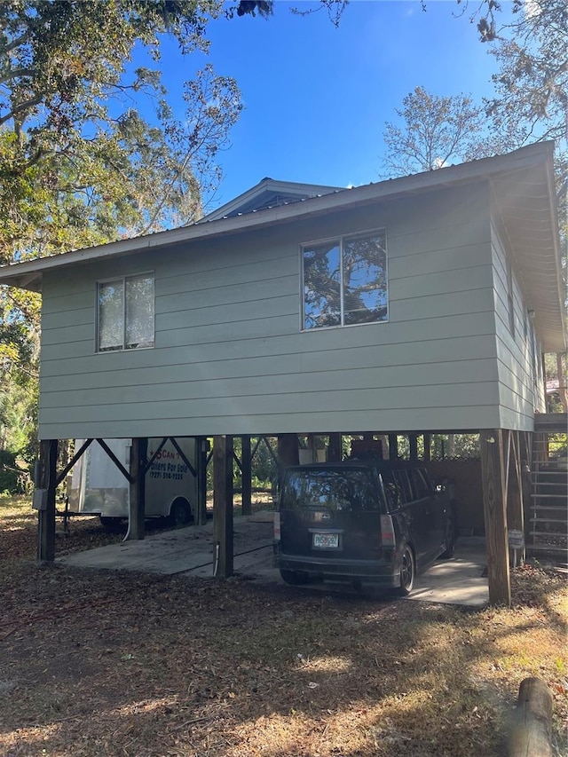 view of home's exterior with a carport