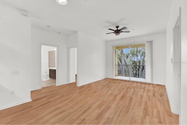 empty room with light hardwood / wood-style floors and ceiling fan