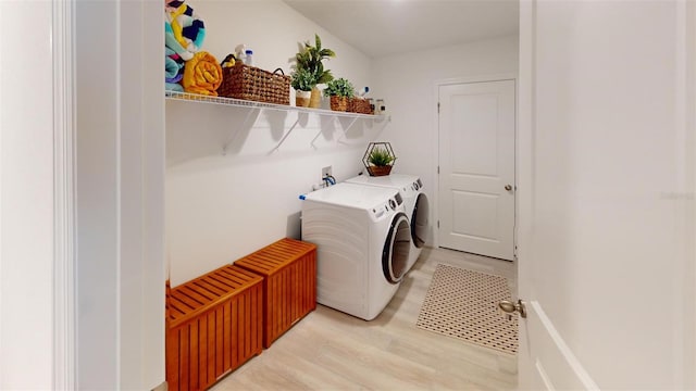 laundry room featuring light hardwood / wood-style flooring and independent washer and dryer