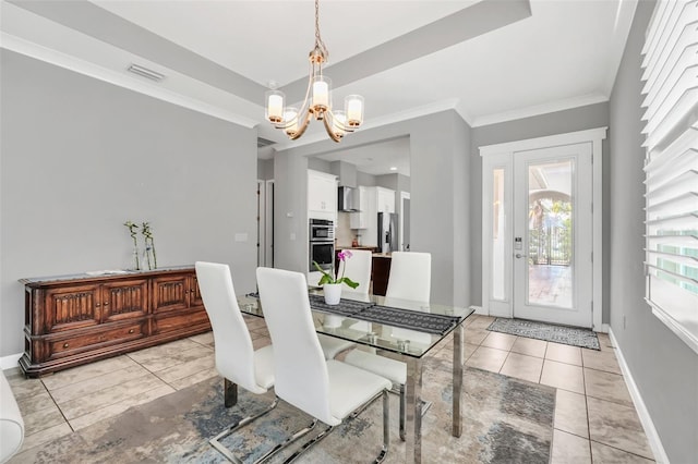 dining room with light tile patterned floors, crown molding, and an inviting chandelier