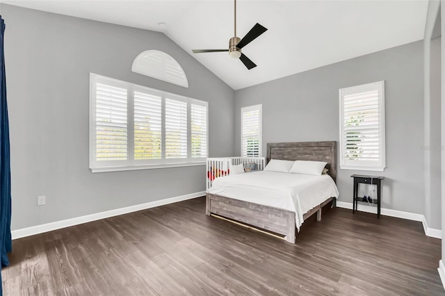 bedroom with ceiling fan, lofted ceiling, and dark wood-type flooring