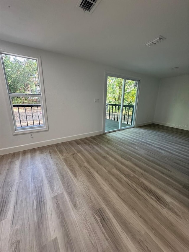 spare room with light wood-type flooring