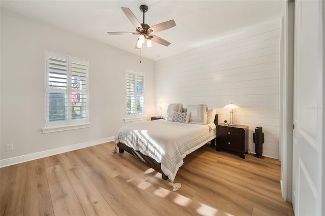 bedroom featuring light hardwood / wood-style flooring and ceiling fan