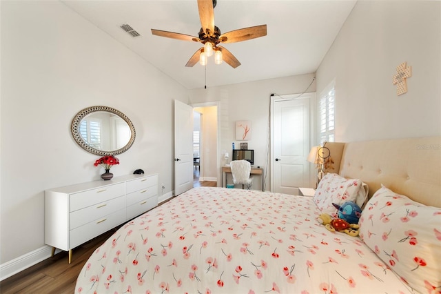 bedroom featuring ceiling fan and dark hardwood / wood-style floors