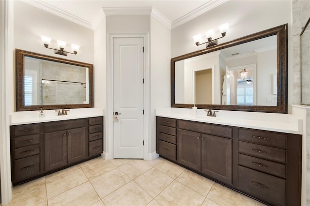 bathroom featuring tile patterned flooring, vanity, and ornamental molding