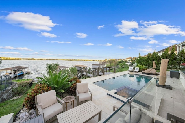 view of pool featuring a water view and a patio area