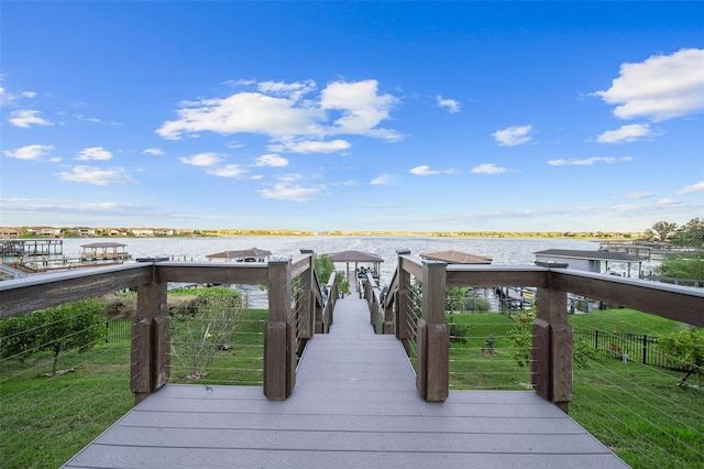 exterior space with a yard and a water view