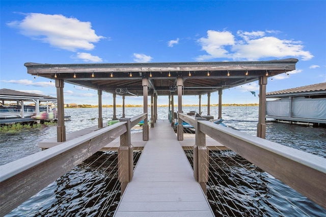 dock area featuring a water view