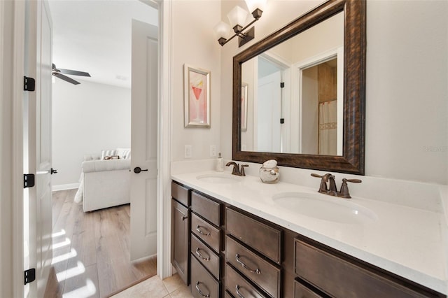 bathroom with hardwood / wood-style flooring and vanity