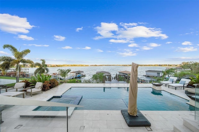 view of swimming pool with a water view and a patio area