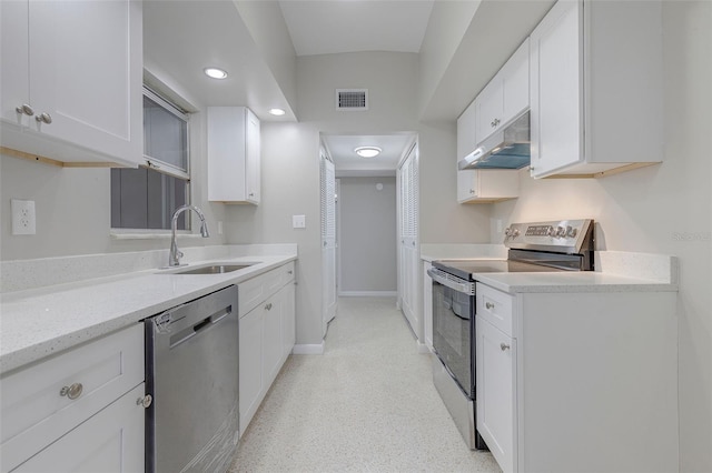 kitchen with light stone countertops, sink, white cabinetry, and stainless steel appliances