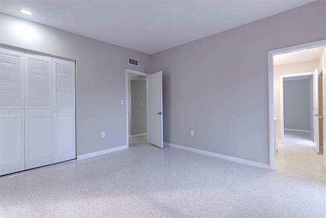 unfurnished bedroom featuring a closet