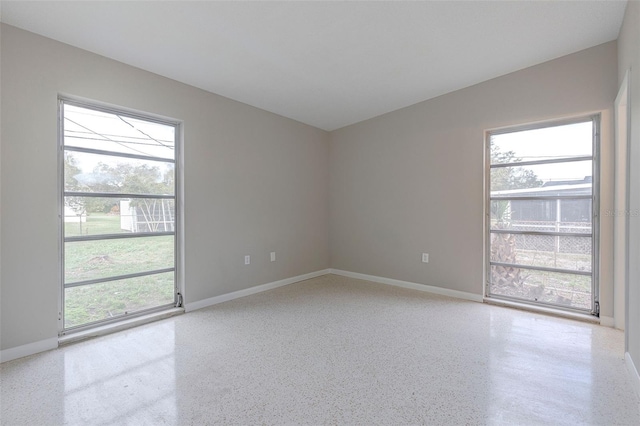 spare room with a healthy amount of sunlight