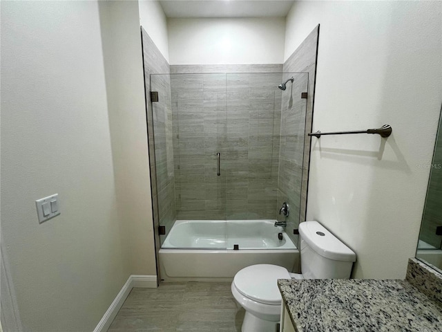 full bathroom with toilet, vanity, and combined bath / shower with glass door