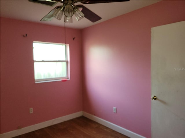 spare room with ceiling fan and wood-type flooring