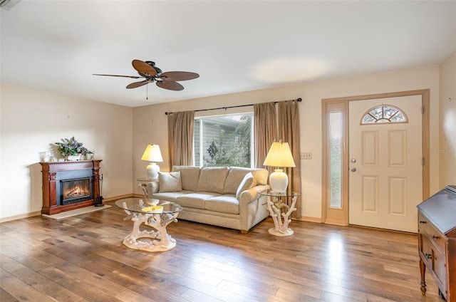 living room with hardwood / wood-style flooring and ceiling fan