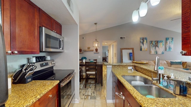 kitchen with appliances with stainless steel finishes, light stone counters, lofted ceiling, and sink