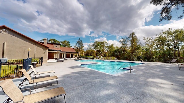 view of pool featuring a patio