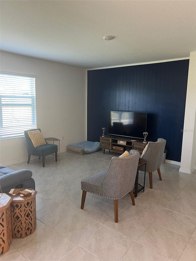 tiled living room featuring wooden walls