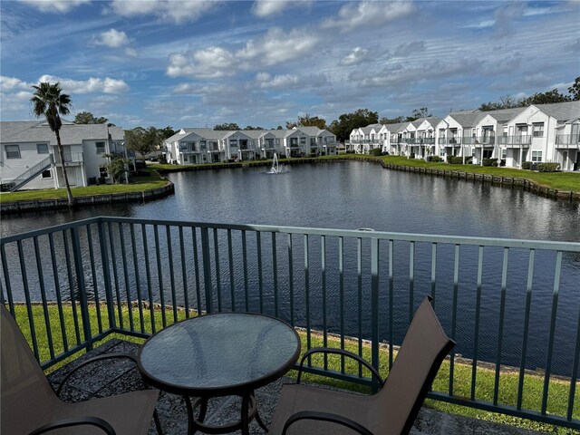 2520 Woodgate Blvd Unit 202, Orlando, FL 32822 - balcony featuring a residential view and a water view