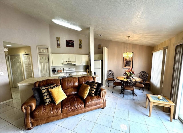 tiled living room with vaulted ceiling, sink, a chandelier, and a textured ceiling