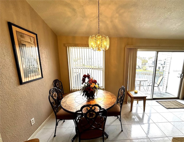 dining room featuring plenty of natural light, a chandelier, and a textured ceiling