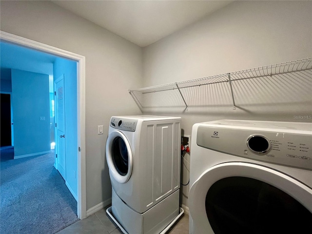 laundry area with light colored carpet and independent washer and dryer