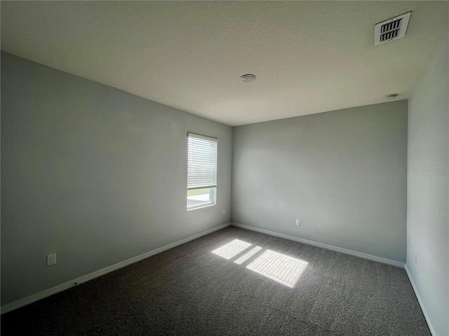 empty room featuring carpet floors