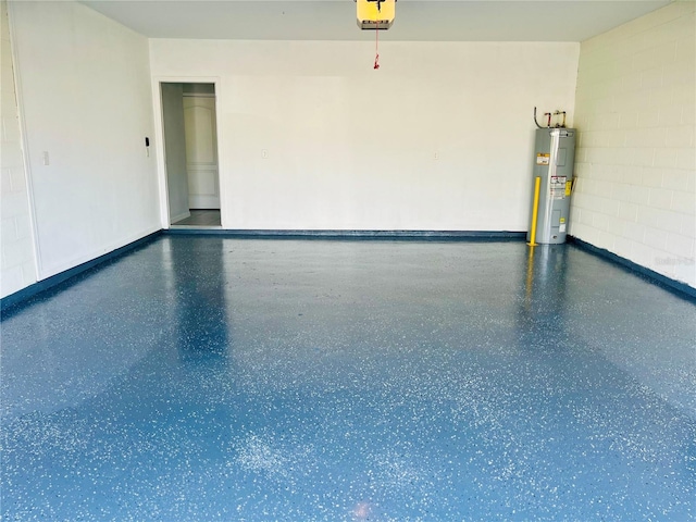 garage featuring a garage door opener and water heater