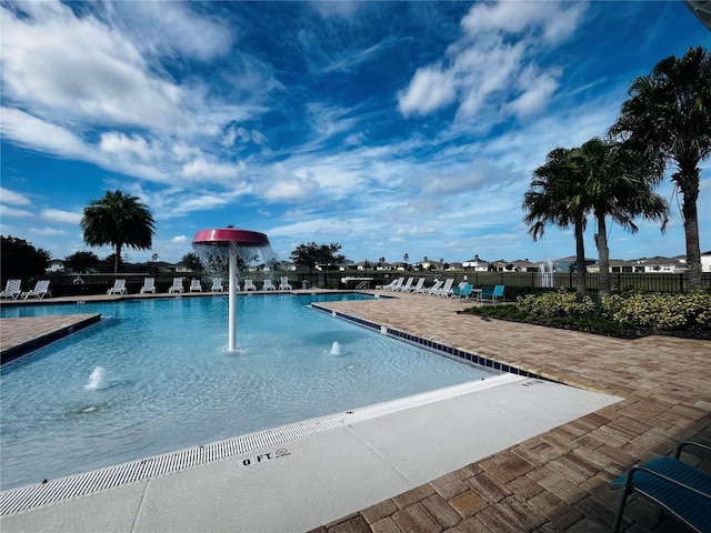 view of swimming pool featuring a patio area and pool water feature