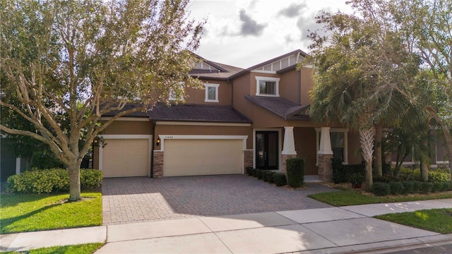 view of front of home with a garage