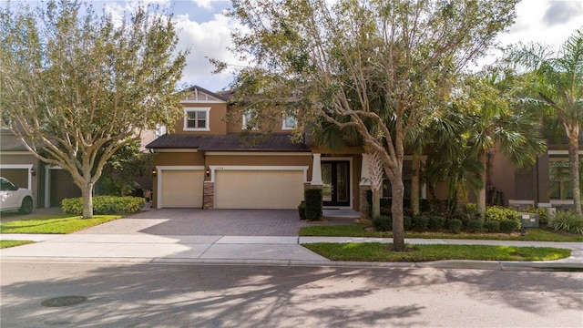 view of front of property with a garage