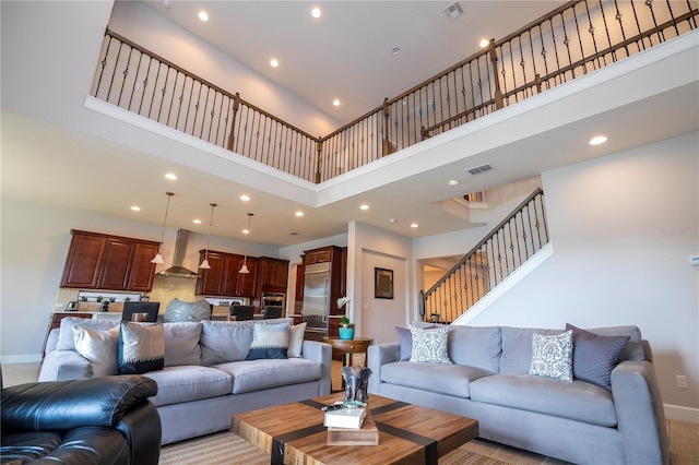 living room with a towering ceiling