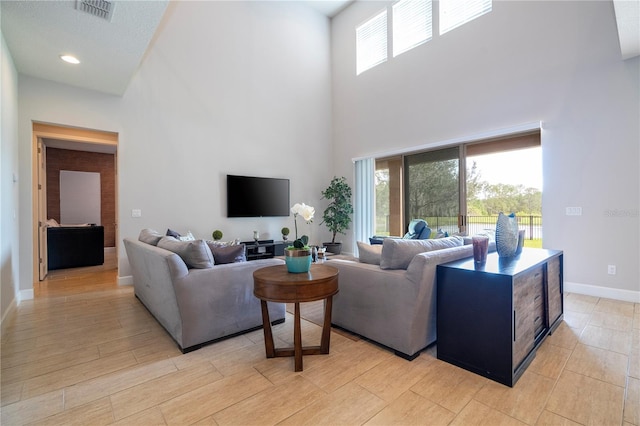 living room with a high ceiling