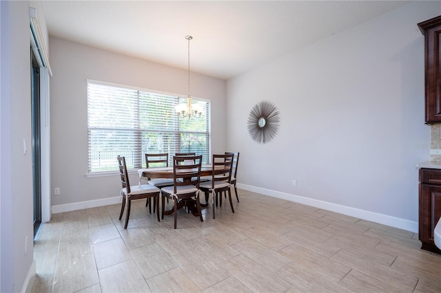 dining space with a notable chandelier