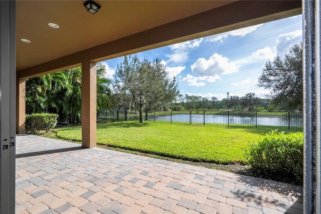 view of patio / terrace featuring a water view