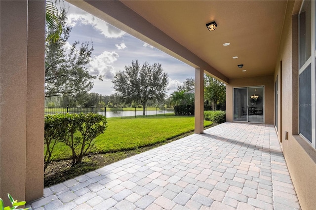 view of patio featuring a water view