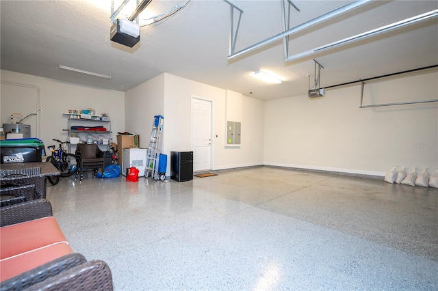 garage with a garage door opener and electric panel