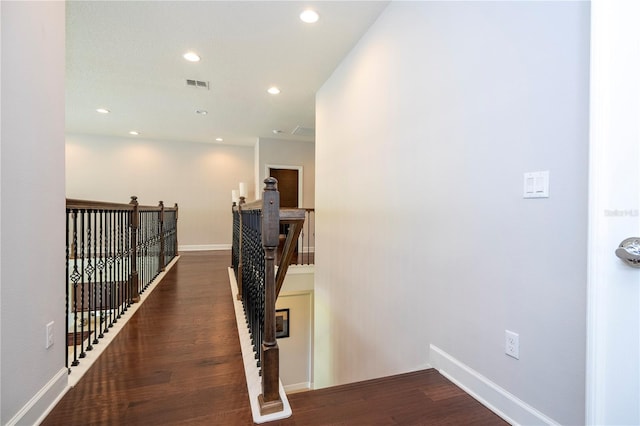 hallway with dark hardwood / wood-style floors