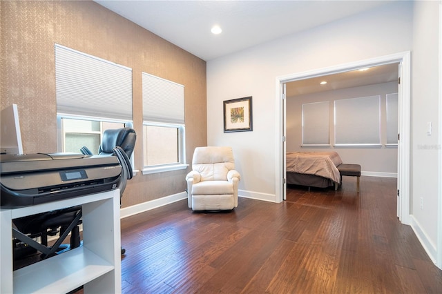 home office with dark hardwood / wood-style flooring