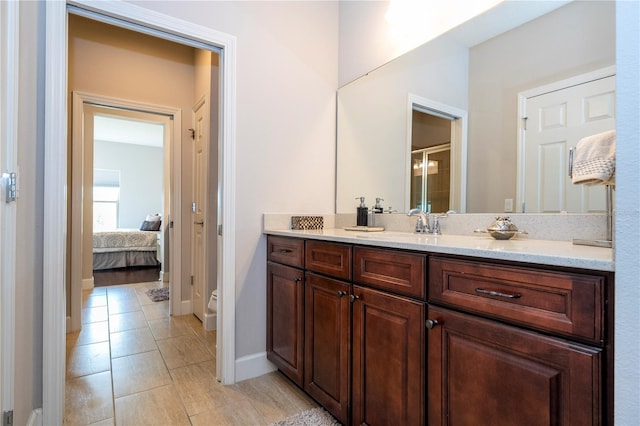 bathroom featuring tile patterned floors, vanity, and toilet