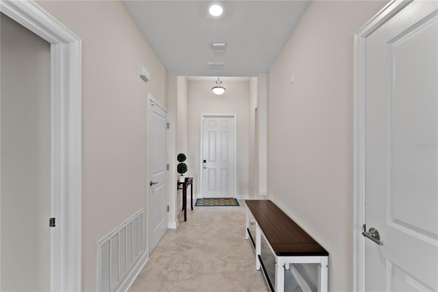 hallway with light tile patterned flooring